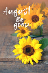 August be good. Yellow Bouquet Of Sunflower. summer cozy still life. sunflowers on rustic wooden background. august month season concept. shallow depth, soft selective focus.