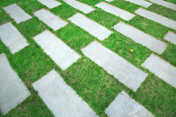 Patterned pavement on the lawn.