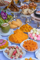 Sacrificial offering food for pray to god and memorial to ancestor, Bangkok, Thailand. Traditional offerings to gods with food, vegetable and fruit for the gods of Thai culture