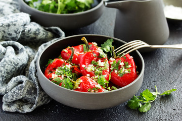 Baked bell peppers salad with herbs and garlic. Eastern dish.