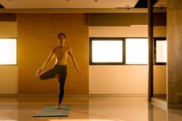 Fototapeta na wymiar Young asian woman perform yoga training with very flexible body