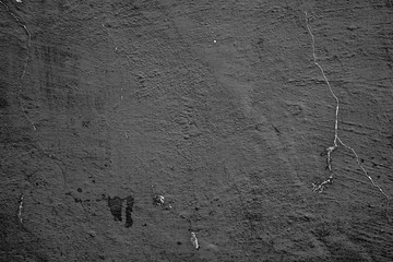Texture of a concrete wall with cracks and scratches which can be used as a background
