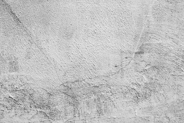 Texture of a concrete wall with cracks and scratches which can be used as a background