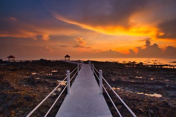Fototapeta premium Fine art image of jetty at Tanjung Balau,Kota tinggi Malaysia. Soft Focus due to long exposure