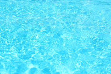 Surface of swimming pool with clean blue water, closeup