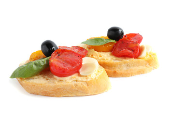 Delicious tomato bruschettas on white background. Traditional Italian antipasto