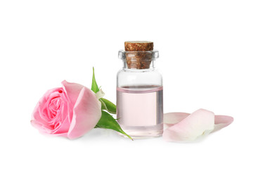 Fototapeta na wymiar Bottle of essential oil and rose on white background