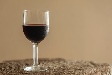red wine glass placed on old wooden table