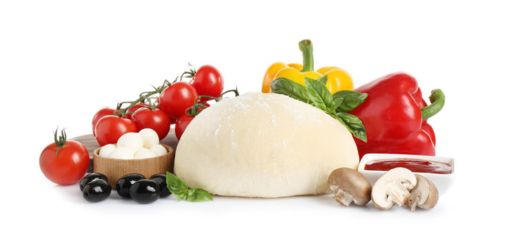 Fresh Dough And Ingredients For Pizza On White Background