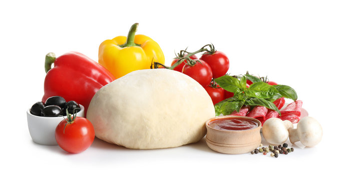 Fresh Dough And Ingredients For Pizza On White Background