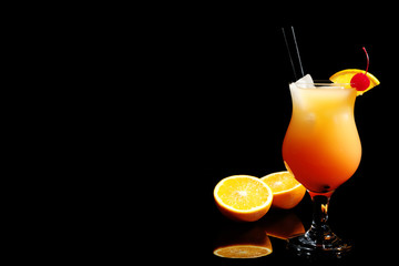 Just made appetizing cocktail Sex on the Beach, black background. Space for text