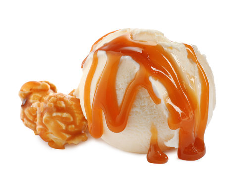 Scoop of delicious ice cream with caramel sauce and popcorn on white background