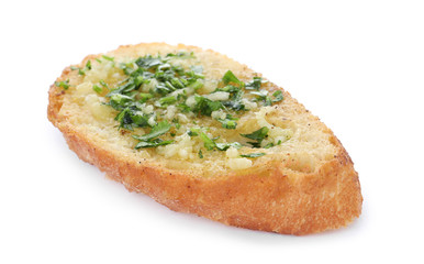 Slice of toasted bread with garlic and herb on white background