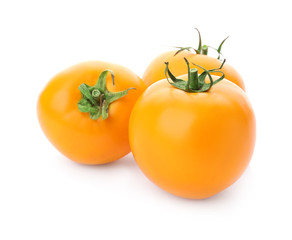 Delicious ripe orange tomatoes on white background