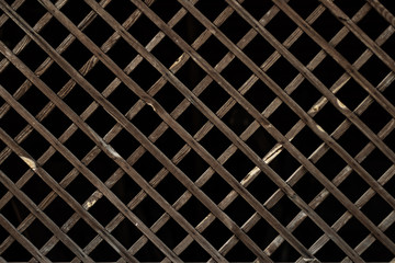 Wooden grill with a dark background