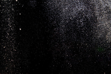 Abstract dust explosion on a black background
