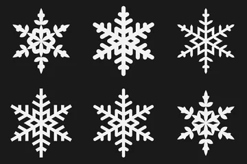 Fotobehang White snowflake icons isolated on a black background. Symbols of Christmas © Andrew