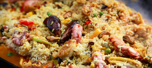 Typical spanish seafood paella in traditional pan