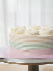 Butter cream cake on table, food concept.