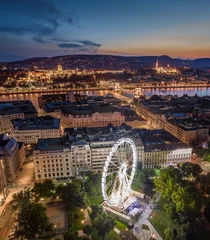 Poster Budapest, Hungary - Aerial panoramic skyline view of Budapest at blue hour with illuminated ferris wheel at Elisabeth Square, Szechenyi Chain Bridge, Buda Castle Royal Palace and Fisherman's Bastion © zgphotography