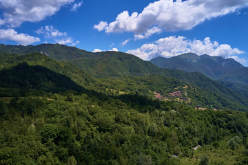 Naklejka na ściany i meble Aerial photography. Panoramic view of the Alps north of Italy. Trento Region, San Lorenzo Dorsino. Great trip to the Alps