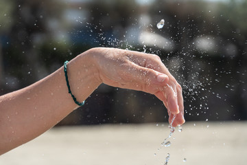 Fototapeta premium Female hands under running water