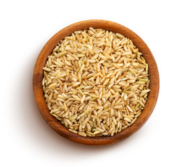 Brown rice groats isolated on white background, top view