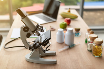 Medicine bottles and microscopes on the doctor's desk