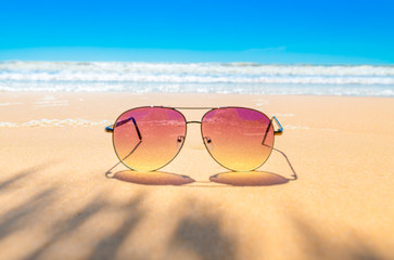 Fototapeta na wymiar Sunglasses on the coastal beaches under the sun