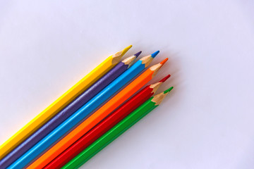 Fototapeta premium Colour pencils on white background. Сlose up. Copy space.