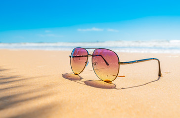 Obraz na płótnie Canvas Sunglasses on the coastal beaches under the sun