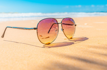 Obraz na płótnie Canvas Sunglasses on the coastal beaches under the sun