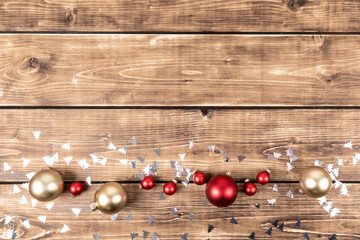 red and gold christmas balls with confetti trees