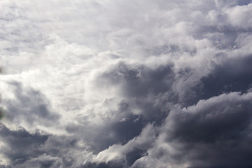 Fototapeta premium impressive fluffy storm rain clouds sky with heaven light