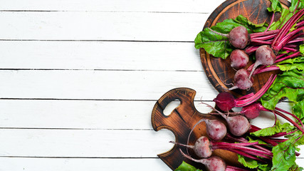 Fresh beet on a white wooden background. Healthy food. Top view. Free space for your text.