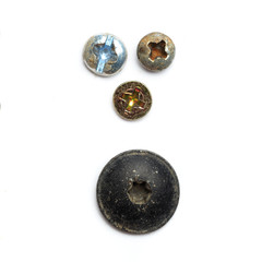 Screw heads, nuts, rivets isolated on white.