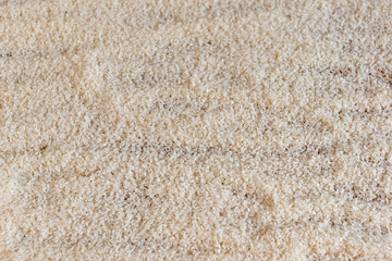 Polished Japanese rice grain on straw mat