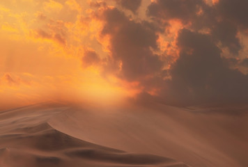 Naklejka na ściany i meble Beautiful gold sand dunes and dramatic sky with bright clouds in the Namib desert