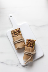 Granola bar. Healthy snack on marble background with copy space