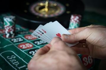 Obraz premium People and entertainment concept. Casino, gambling, poker, roulete