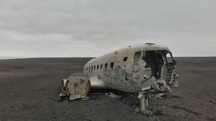 Naklejka na ściany i meble Solheimasandur Plane Wreck, Iceland. Aerial view of airplane wreckage on the beach