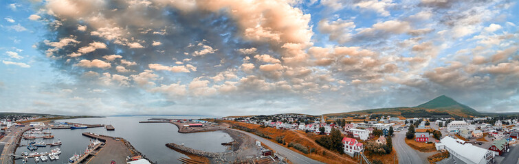 Panoramic sunset aerial view of Husavik port in Northern Iceland, the city is famous for whales tours