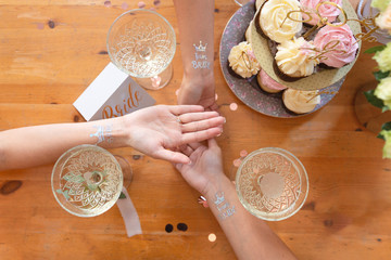 Fototapeta na wymiar Hands of the bride and bridesmaids, engagement rings