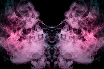 Smoke of different blue, red and pink colors in form of horror in the shape of the head, face and eye with wings on a black isolated background. Soul and ghost in mystical symbol. Print for clothes.