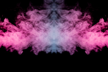 Smoke of different blue, red and pink colors in form of horror in the shape of the head, face and eye with wings on a black isolated background. Soul and ghost in mystical symbol. Print for clothes.