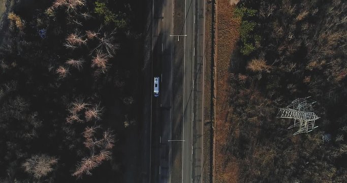A highway road filmed perpendicularly from above.