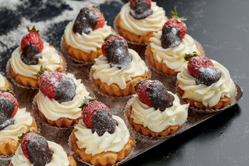 Pattern of cream bignè with strawberry