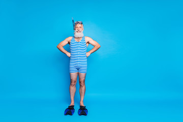 Full size photo of retired sailor with snorkeling equipment wearing striped costume isolated over blue background