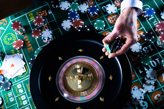 People and entertainment concept. Casino, gambling, poker,  roulete