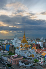 Cityscape of beautiful Wat Traimit or Temple of the Golden Buddha where the biggest solid golden Buddha statue is installed near the Chinatown , Bangkok , Thailand